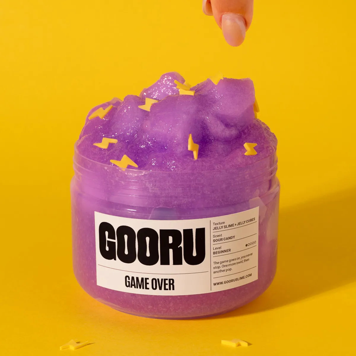 Purple slime jar with 'GOORU' label on a yellow background
