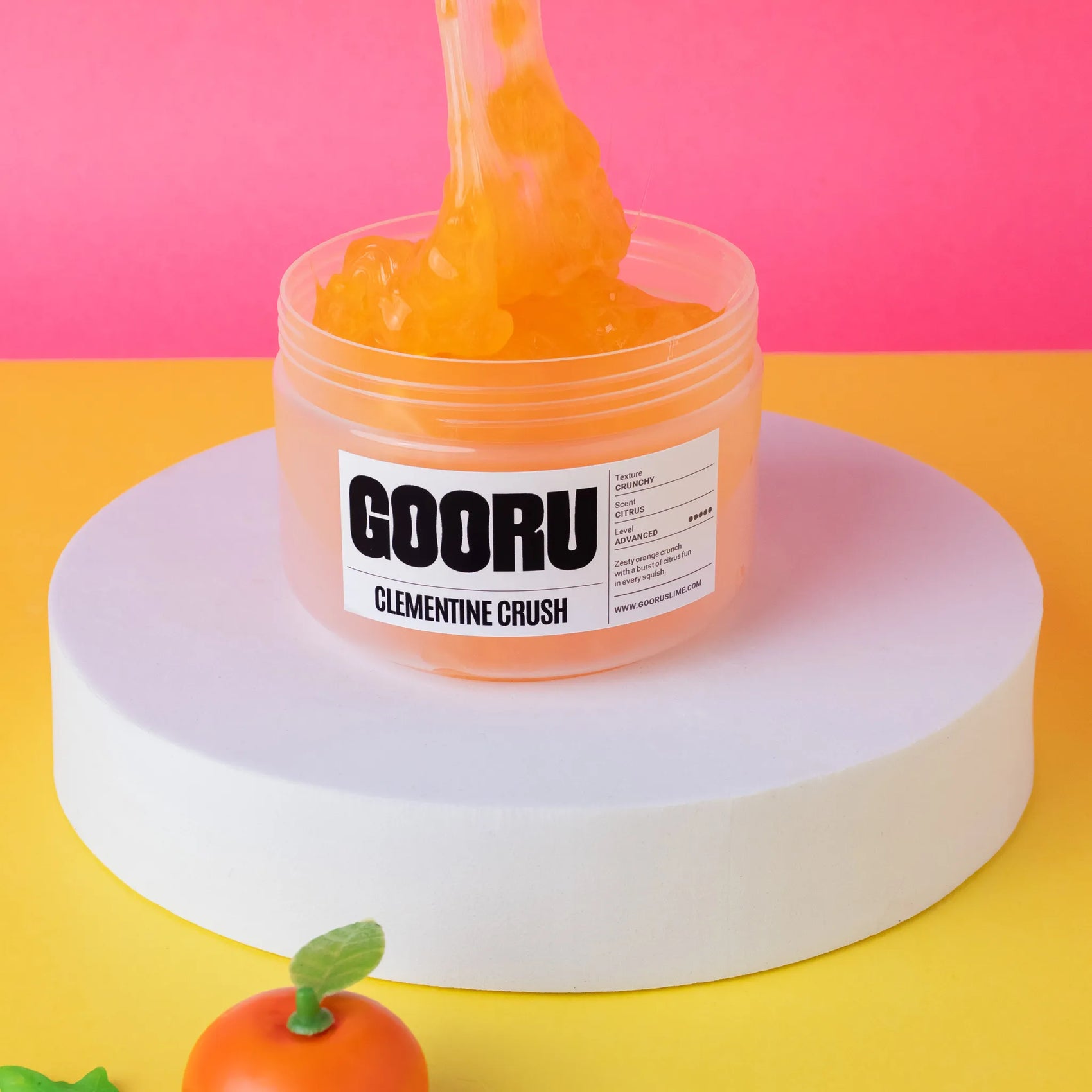 Jar of GOORU Clementine Crush on a colorful background