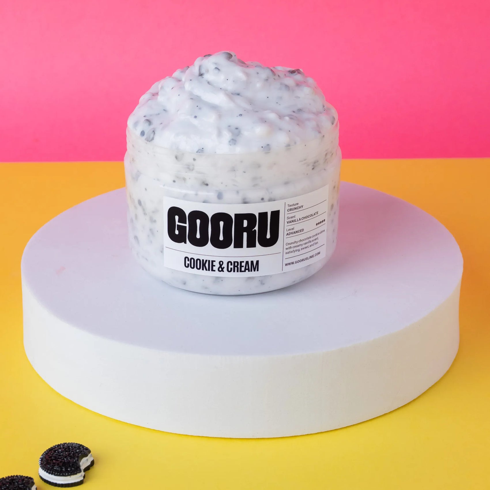 Jar of 'Cookie & Cream' ice cream on a pink and yellow background with 'GOORU' branding.
