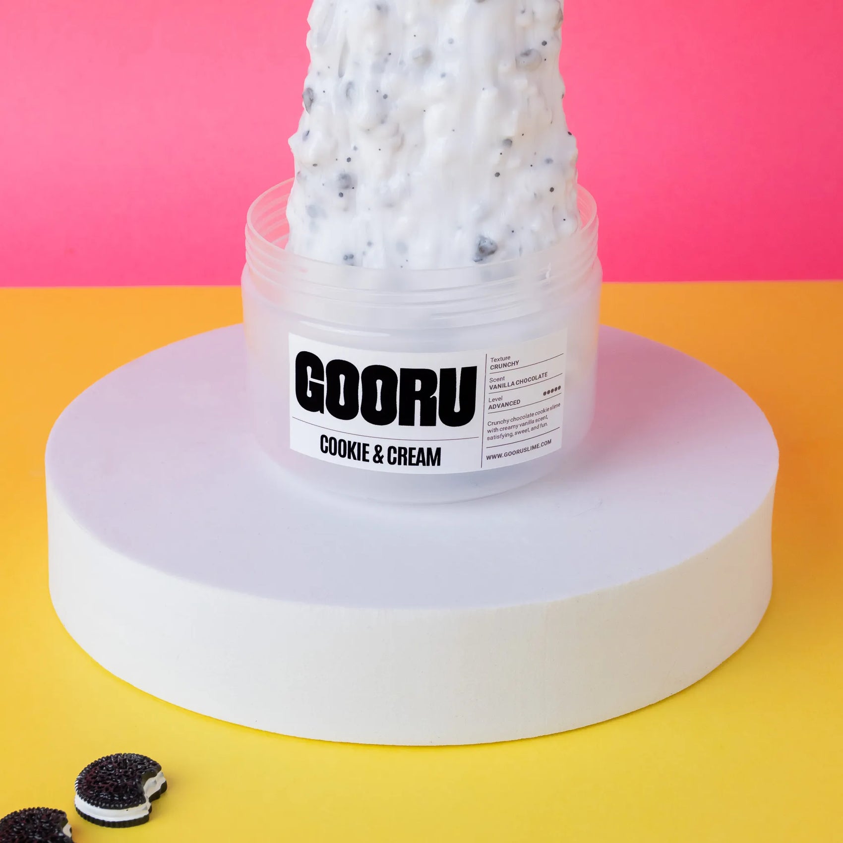 Jar of GOORU cookie and cream slime on a colorful background