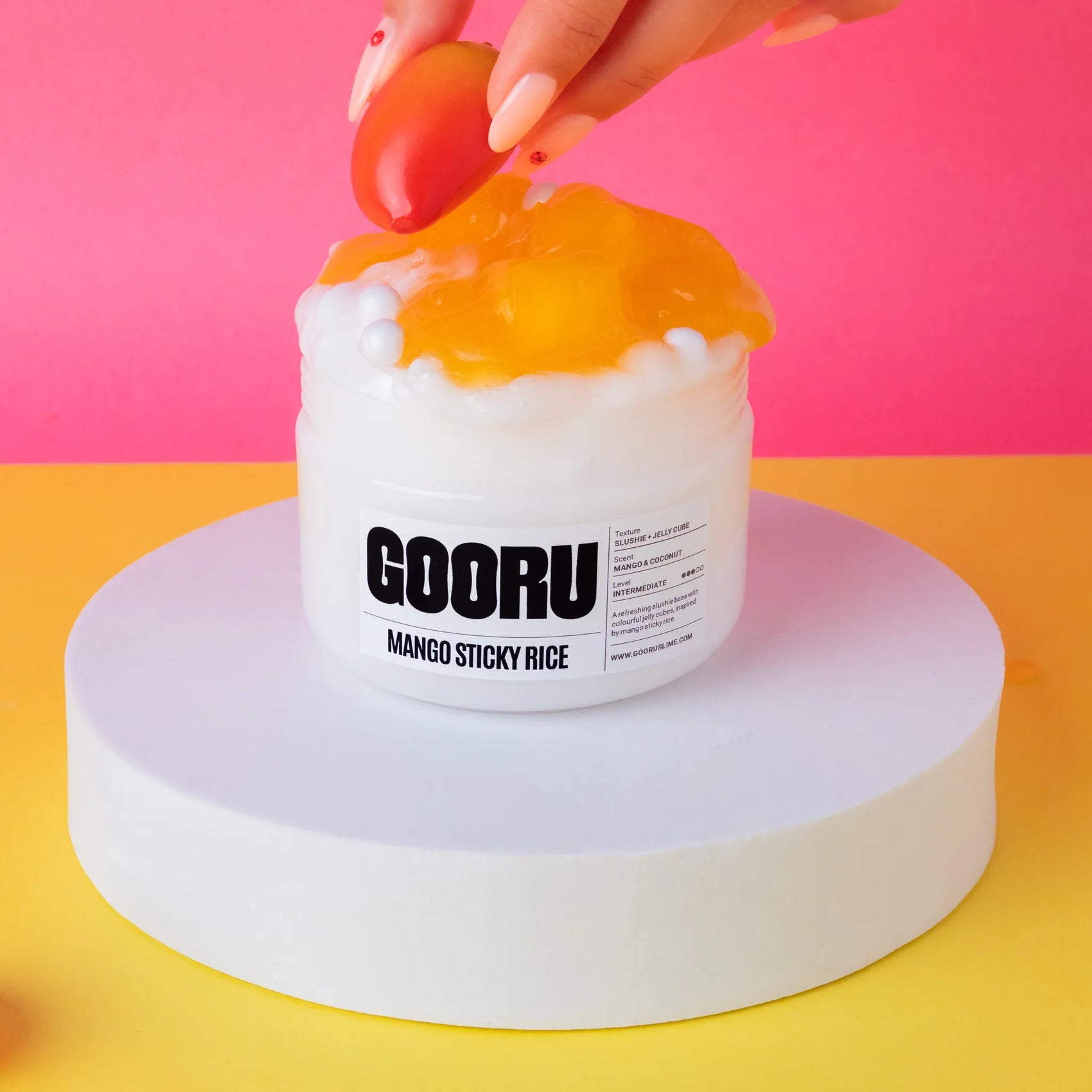 GOORU Mango Sticky Rice slime on a pink and yellow background
