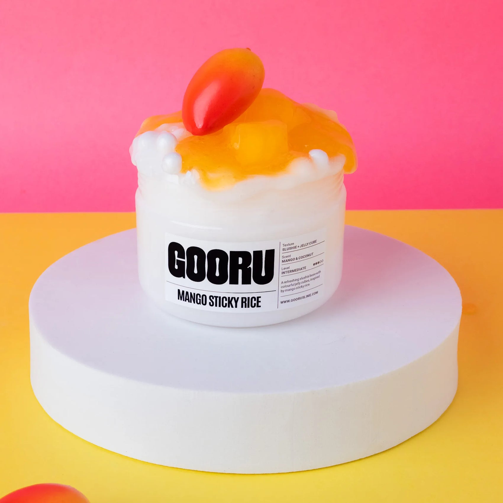 Mango sticky rice slime with GOORU branding on a pink and yellow background
