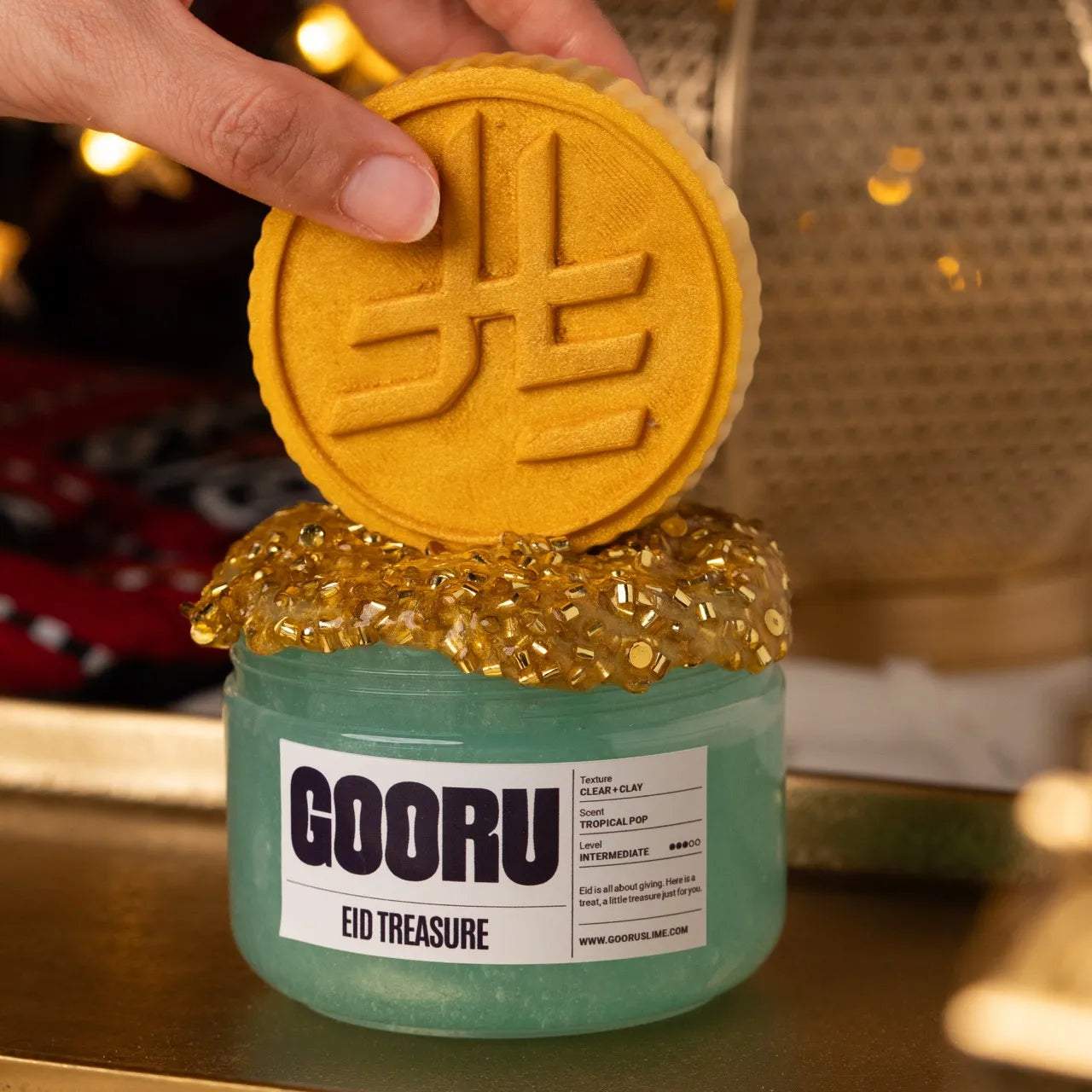 Eid Treasure by Gooru Slime: clear and clay slime with golden glitter bingsu and a riyal coin topper. Handmade in the UAE.