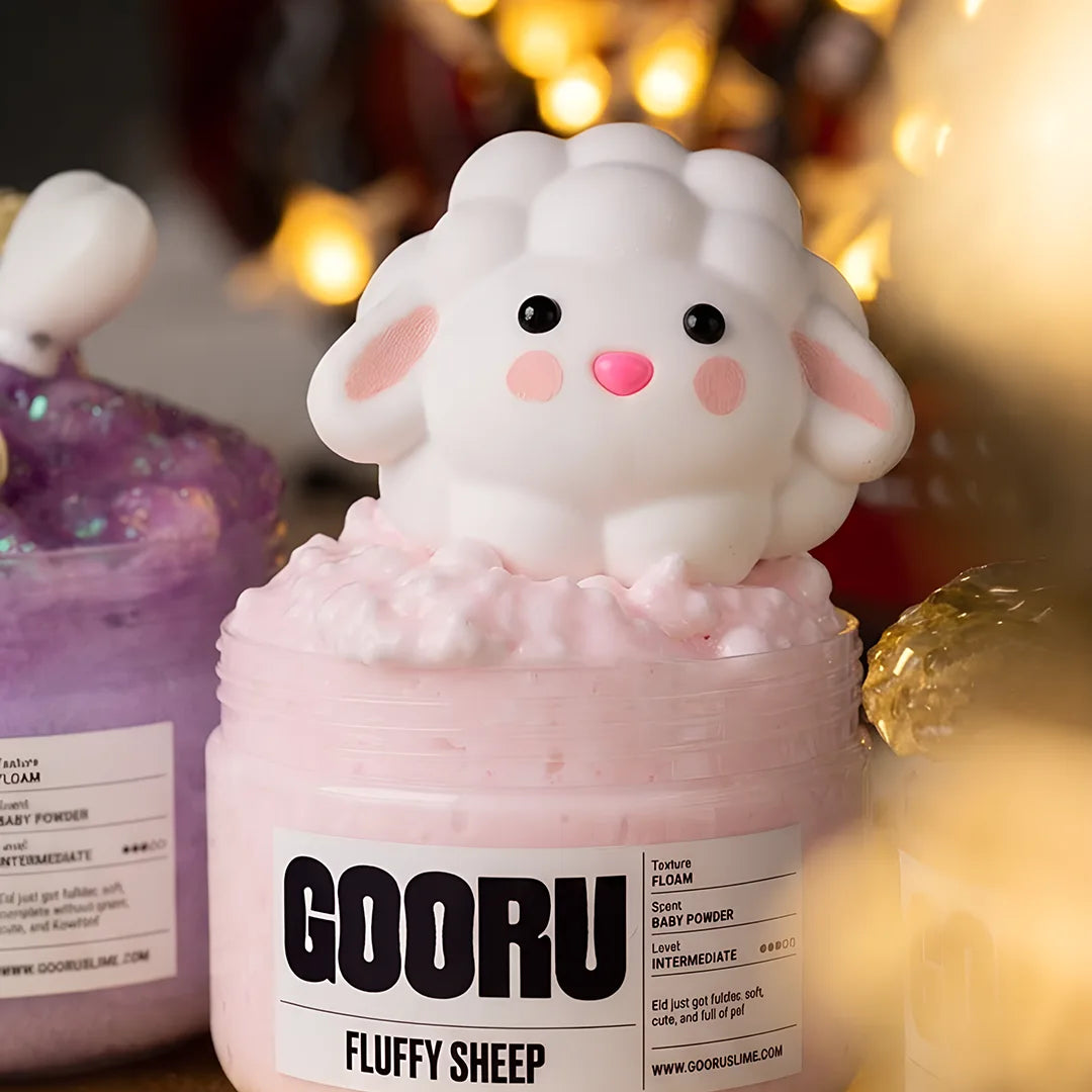 Fluffy Sheep by Gooru Slime: light floam slime with a sheep charm and baby powder scent. Handmade in the UAE.