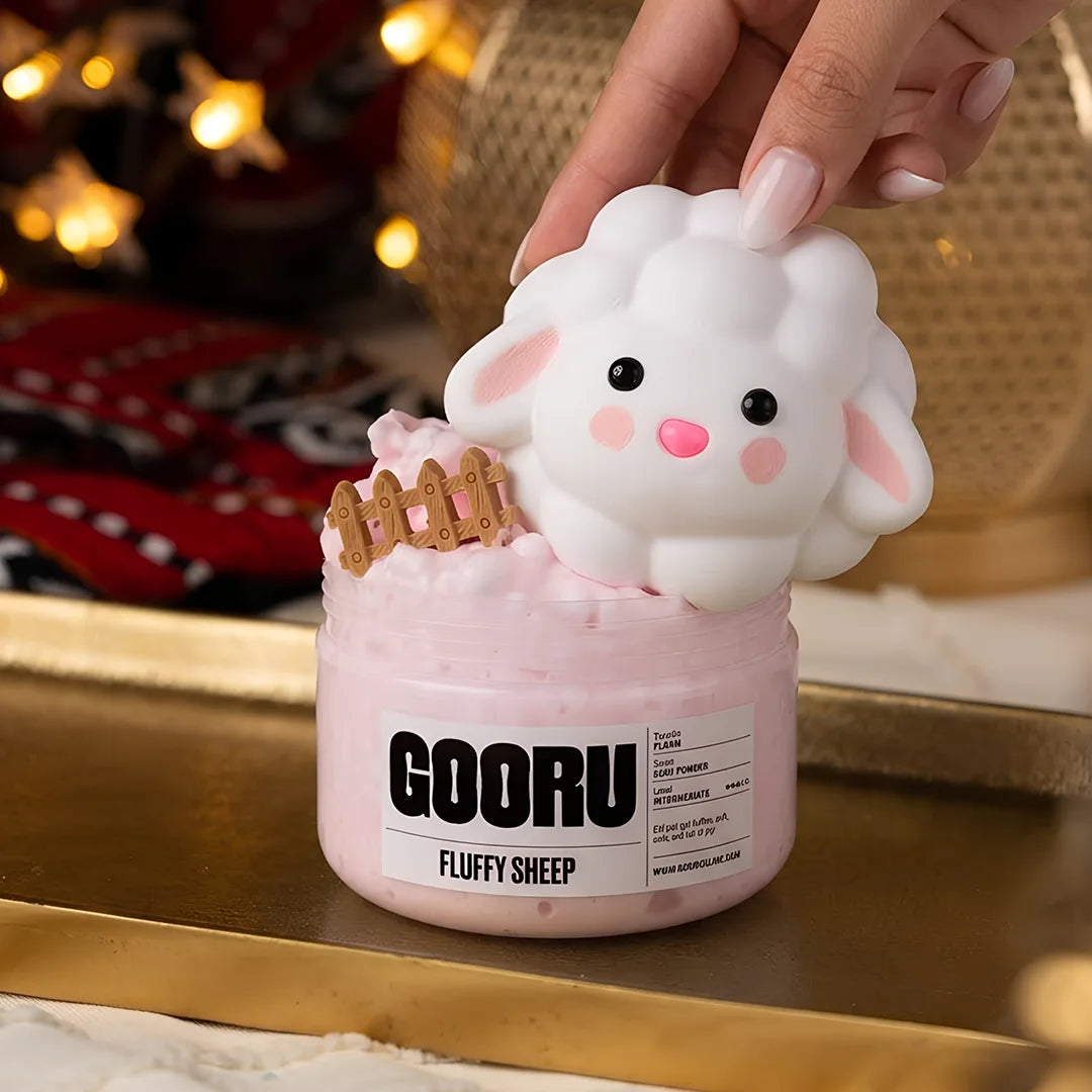 Fluffy Sheep by Gooru Slime: light floam slime with a sheep charm and baby powder scent. Handmade in the UAE.